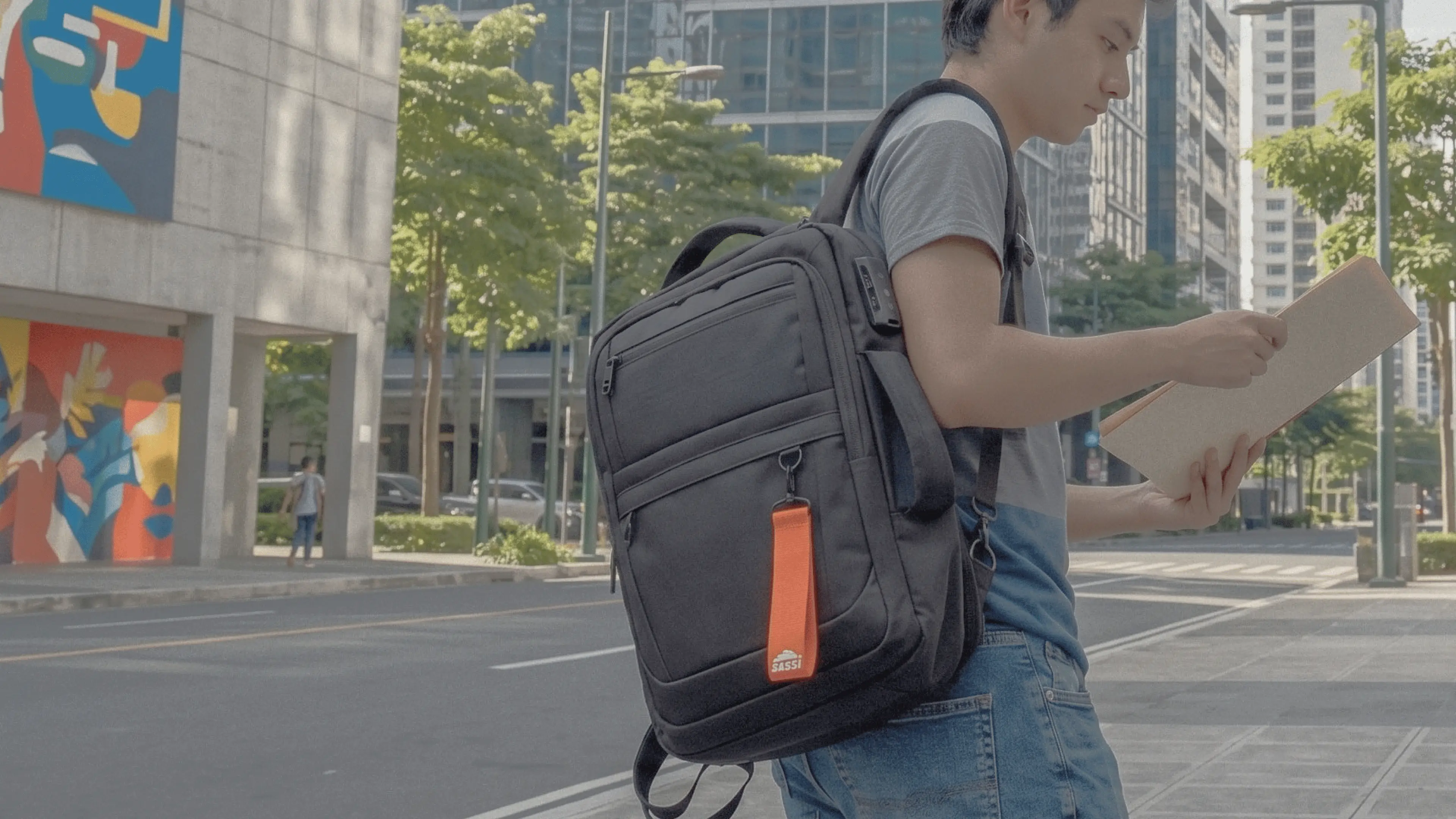 Professional carrying a SASSI backpack on a city workday