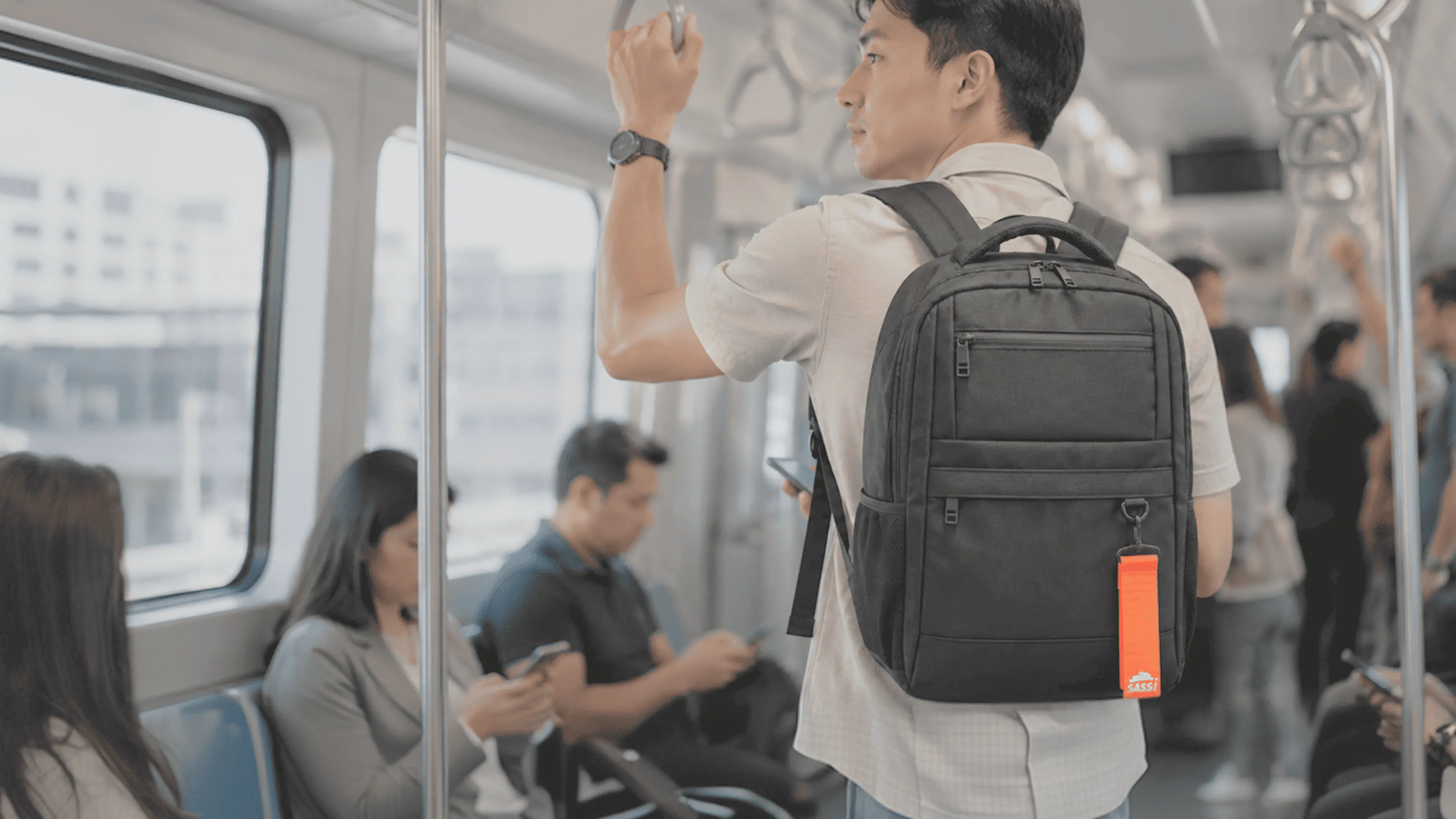 Professional with SASSI backpack on a daily train commute